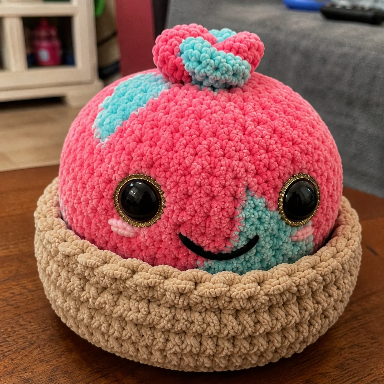 Crocheted dumpling amigurumi sitting inside its bamboo steamer
