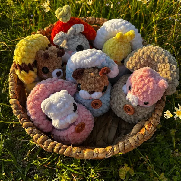 Mini crocheted pig hatching from its egg